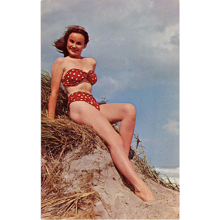 Brunette Bathing Beauty Red Polka Dot Bikini Sitting on Sand Dune Vintage Postcard (unused) - Vintage Postcard Boutique
